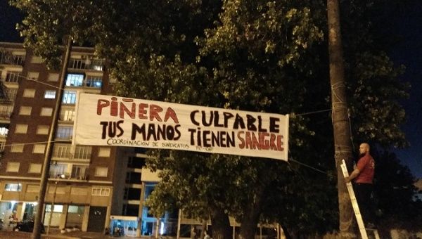 Hundreds of protesters take to the streets of Montevideo, Uruguay, to repudiate the presence of Sebastian Piñera in the country.