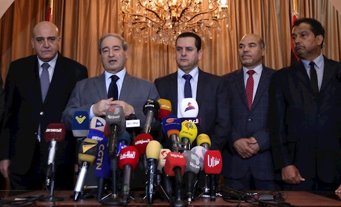 Syria’s Deputy Foreign Minister Faisal Mikdad (2-L) and Libya’s Foreign Affairs Minister Abdul-Hadi al-Hawaij (3-R) at the opening ceremony of the Libyan Embassy in Damascus, Syria, March 03, 2020.