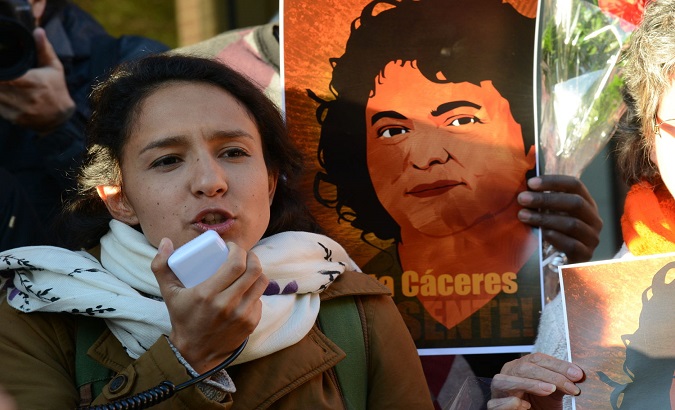 General Coordinator of COPINH Bertha Cáceres Zúñiga, next to her mother's image 4 years after Caceres political femicide, February, 2020.