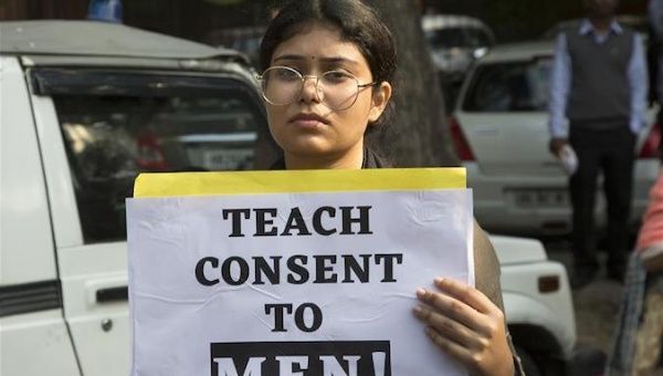 A woman carries a placard during a protest over a rape-and-murder case in New Delhi, India, on Dec. 2, 2019. 