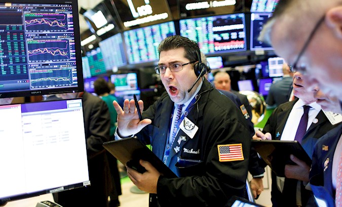 New York Stock Brokers work this Wednesday on Wall Street, New York