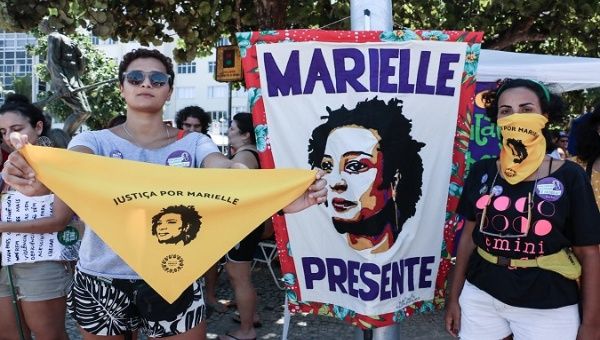Brazilian women carry Marielle's image in Women's Day demonstrations