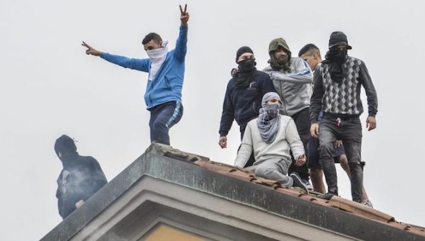 Detainees protest on the roofs of the San Vittore prison in Milan, northern Italy, 9 March 2020.