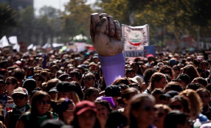 Women marching along the Alameda avenue in Santiago, Chile, March 9, 2020.