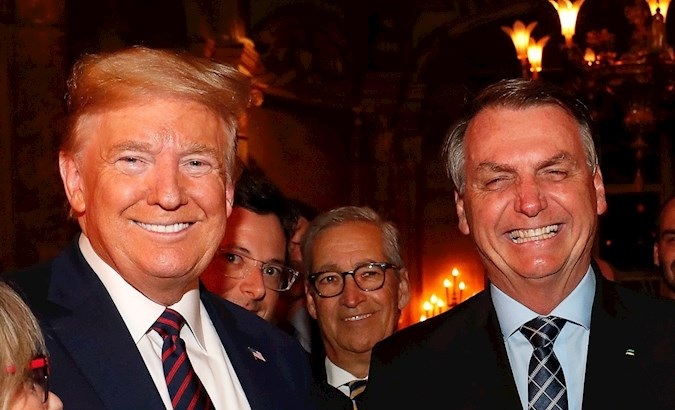 President Jair Bolsonaro (R), his Press Secretary, Fabio Wajngarten (2-L, partially obscured), and President Donald Trump, Palm Beach, USA, March 7, 2020