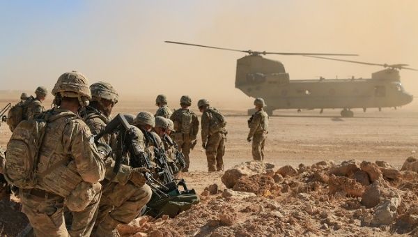Soldiers get ready to board a CH47 Chinook during  a live-fire training exercise in Iraq, October 31, 2018.  