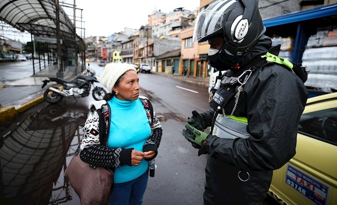 Police carry out controls to prevent the presence of people and vendors on the streets, Quito, Ecuador, March 17, 2020.