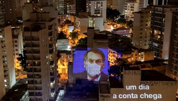 View of a projection of the President of Brazil, Jair Bolsonaro, on the facade of a building, during the cacerolazo against the president this Thursday, in Sao Paulo
