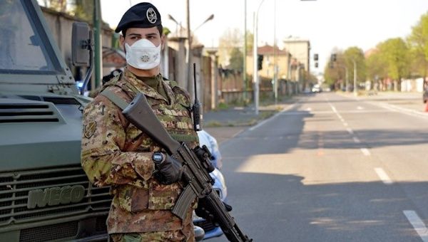 Italian soldier stands guard at a check point in Sesto San Giovanni, Italy, April 8, 2020.
