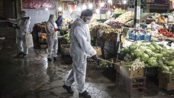 Volunteers disinfect a bazaar in Tehran, Iran, on March 31, 2020
