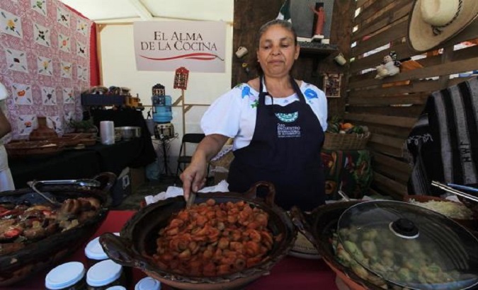 A Mexican cook prepares traditional dishes at the International Gastronomy Summit, Guanajuato, Mexico, June 3, 2018.