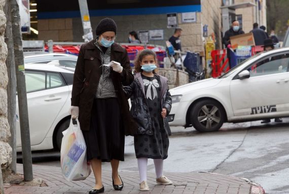 People wearing masks are seen in Jerusalem amid coronavirus pandemic on April 10, 2020.