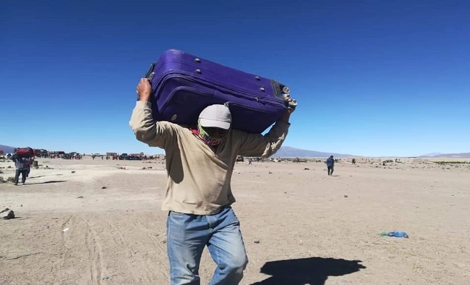 Bolivians leave the Chile/Bolivia border, after the mayor of Iquique offered shelter to 825 migrants stranded in Colchane.
