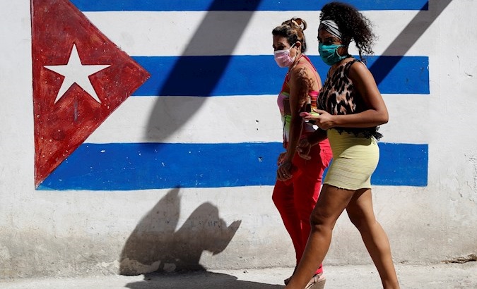 Women walk the streets of Havana, Cuba, March, 2020.