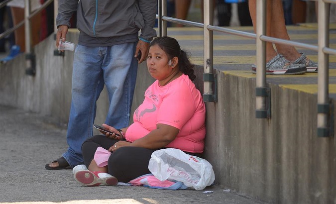 A woman waits outside the Jose Rodriguez Infectology Hospital, Guayaquil, Ecuador, April, 03, 2020.