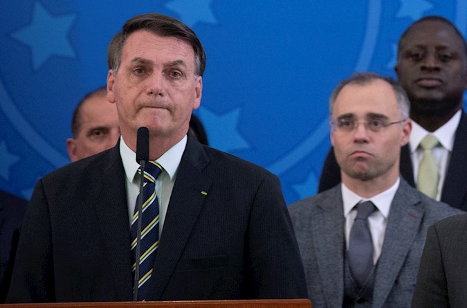 he President of Brazil, Jair Bolsonaro (l), along with the new Minister of Justice, André Luiz de Almeida Mendonça (r) , during an event in Brasilia