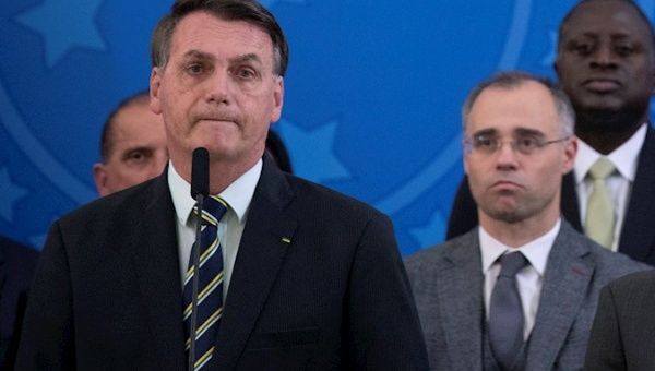 he President of Brazil, Jair Bolsonaro (l), along with the new Minister of Justice, André Luiz de Almeida Mendonça (r) , during an event in Brasilia 