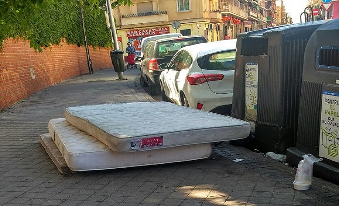 COVID victims' mattresses abandoned on the streets of Madris, Spain. May 26, 2020.