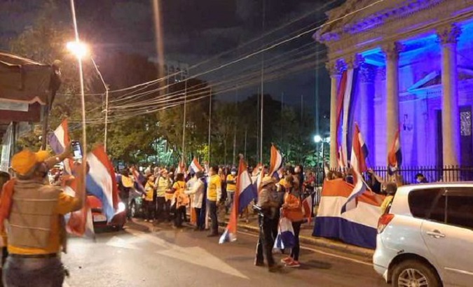 People protest in the vicinity of the Pantheon of Heroes, Asuncion, Paraguay, June 3, 2020.