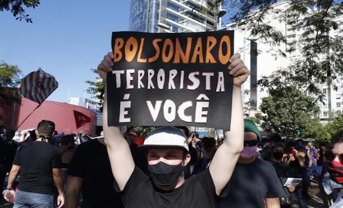 Dozens of people participate in a protest against Brazil's President Jair Bolsonaro, Sao Paulo, Brazil, June 7, 2020.