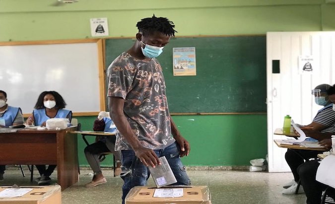 A young man participates in the Dominican Republic's elections in Santo Domingo, July 5, 2020.
