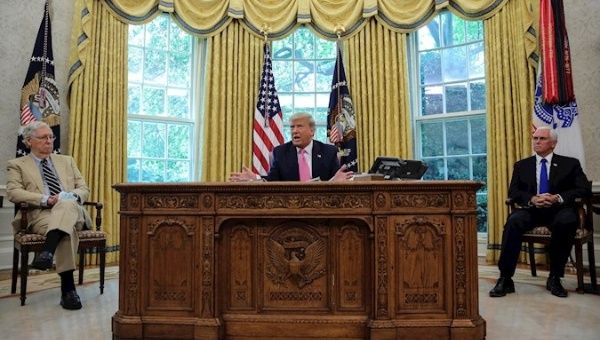 President Donald Trump in the Oval Office, Washington DC, U.S., July 20, 2020.
