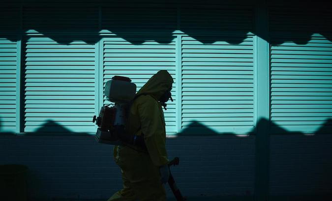A school in Brasilia gets disinfected by a health worker. July 31, 2020.