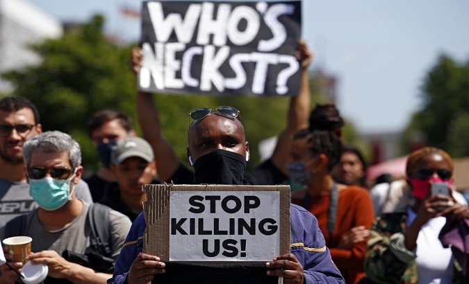 Citizens demonstrate against racism and police brutality in U.S, Washington, May 31, 2020.