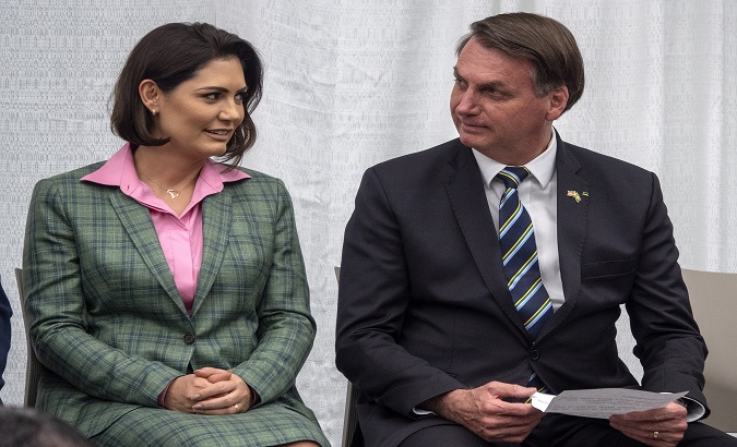 President Jair Bolsonaro and his wife Michelle speak during a meeting, Miami, U.S. March 9, 2020. ,