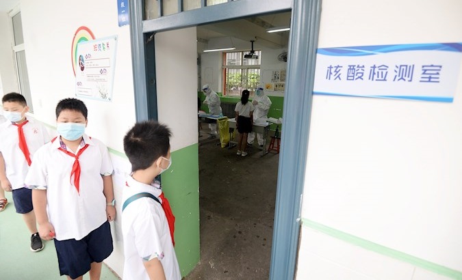 Students line up to undergo COVID-19 tests at a primary school, Handan, Hebei province, China, August 17, 2020.