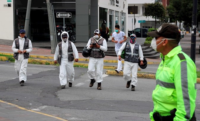 Citizens with personal protective equipment walking, Quito, Ecuador, August 2020.