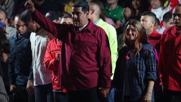 Venezuelan President Nicolas Maduro (C), jubilates the victory with First Lady, Cilia Flores (C-R), after the publication of the electoral results in Caracas, Venezuela on May 20, 2018.