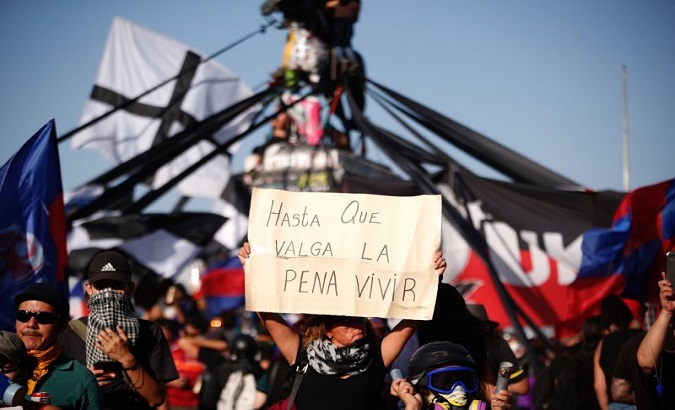 Demonstrators protests against Sebastian Piñera's government in Santiago, Chile, October 26, 2019.