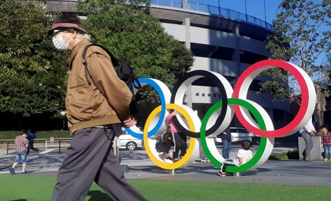 A man walks by an Olympic facility in Tokyo, Japan, Sep.8, 2020.