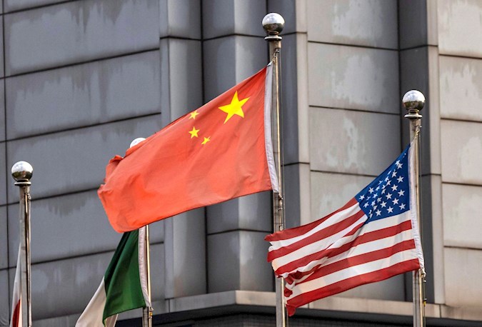 The Chinese and US flags are seen among others outside of the Semiconductor Manufacturing International Corporation (SMIC) factory in Shanghai, China. September 07, 2020.