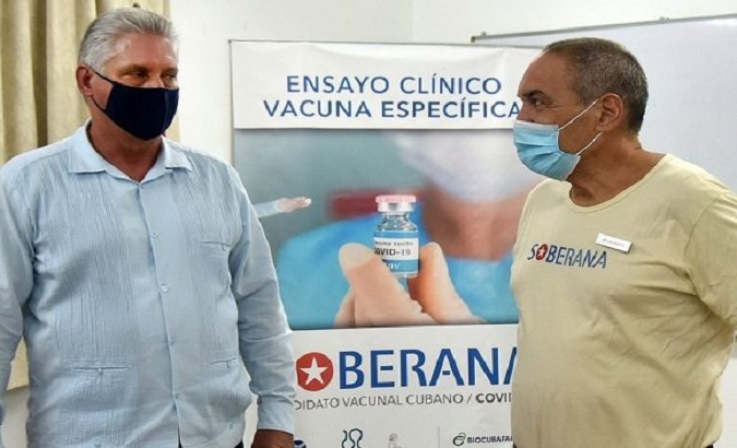 President Miguel Diaz-Canel Bermudez (L) and the Finlay Institute of Vaccines (R) Vicente Verez, Havana, Cuba. Oct. 3, 2020.