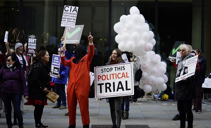 People protest outside the trial of Julian Assange, London, Britain, Oct. 1, 2020.
