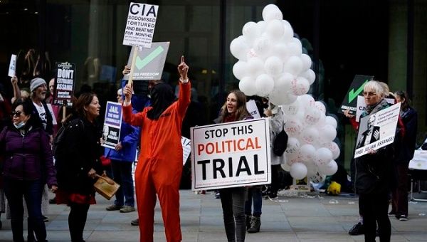 People protest outside the trial of Julian Assange, London, Britain, Oct. 1, 2020.