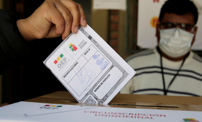 A person exercises his right to vote in La Paz, Bolivia, Oct. 18, 2020