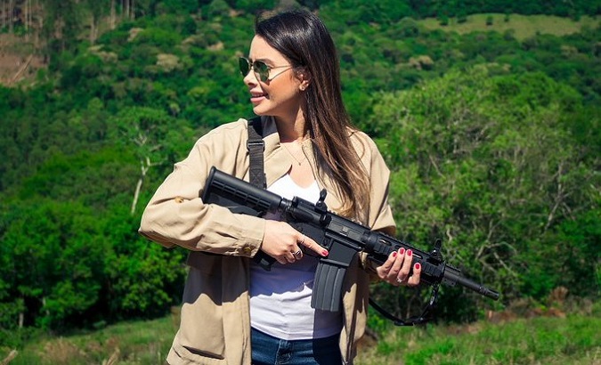 Federal Lawmaker Caroline De Toni, a Bolsonaro supporter, poses with guns, Brazil, Oct. 27, 2020.