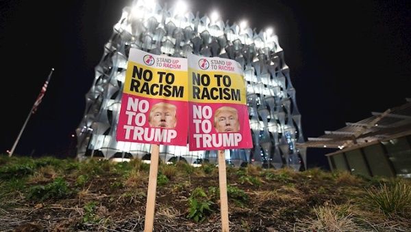 A man protests outside the US embassy in London, Britain, 04 November 2020