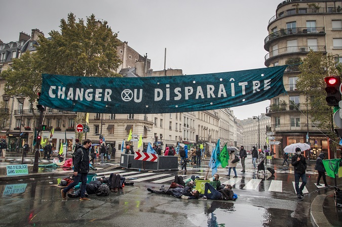 French activists of the global environment movement Extinction Rebellion block the streets near the Environment Ministry in Paris, France, 13 October 2020.