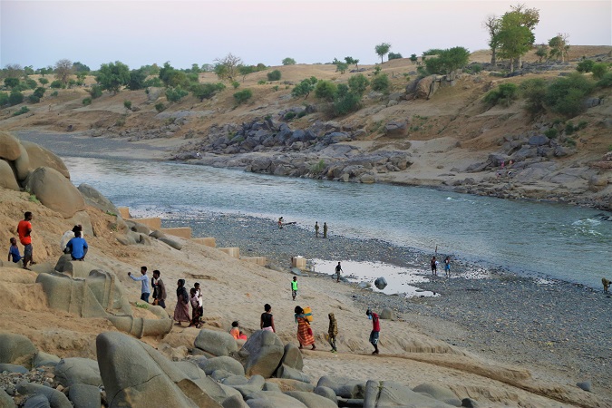 Ethiopian refugees who fled the conflict in Ethiopia's Tigray region on the banks of the Setit River (Tekeze) in eastern Sudan, 17 November 2020 (issued 18 November 2020).