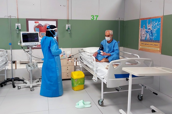 A nurse treats a coronavirus patient at the hospital set up in Iran Mall, a luxury shopping mall, now serving the health emergency with the opening of a hospital for COVID-19 patients in its facilities.