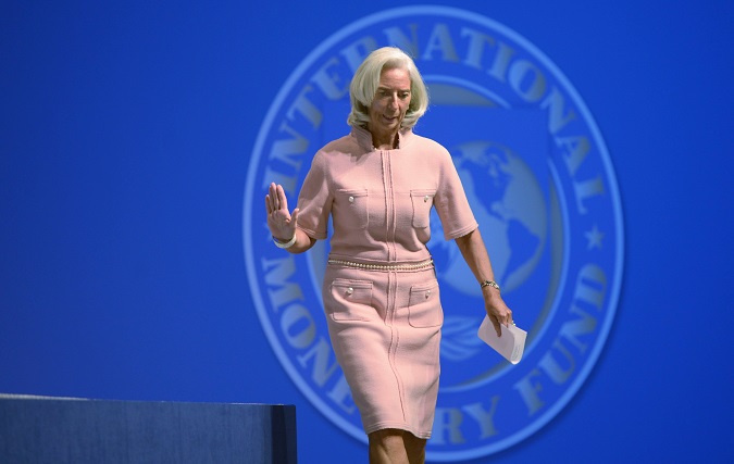 Archival footage of IMF Managing Director Christine Lagarde walking to the podium to deliver remarks at one of the IMF World Bank Annual Meetings in Washington, DC, USA.