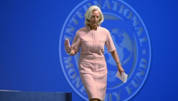 Archival footage of IMF Managing Director Christine Lagarde walking to the podium to deliver remarks at one of the IMF World Bank Annual Meetings in Washington, DC, USA.