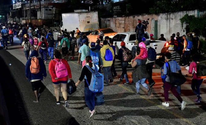 Migrants begin pilgrimage to the U.S. from San Pedro Sula, Honduras, Dec. 9, 2020.