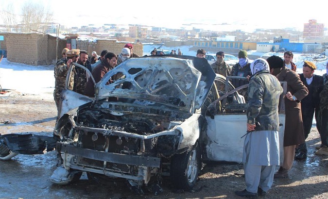 Security force members inspect at the site of a bomb attack in Firoz Koah, Afghanistan, Dec. 15, 2020.