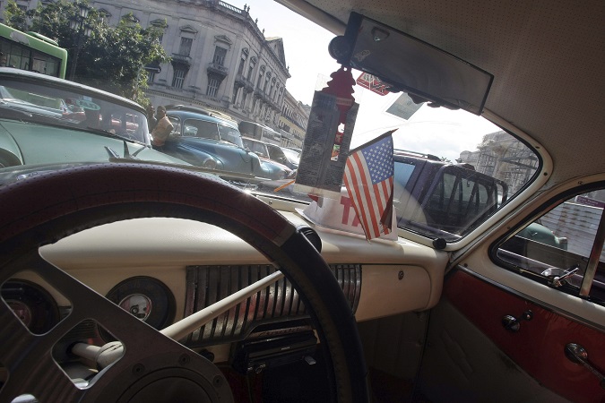 A car with a US flag is seen at the streets of Havana, Cuba. US-Cuba relations are likely to change under the new Democrat administration of President-elect Joe Biden.