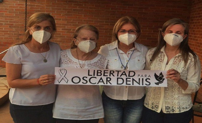 Relatives of ex-Vice President Oscar Denis, Paraguay, Dec. 15, 2020. The sign reads, 